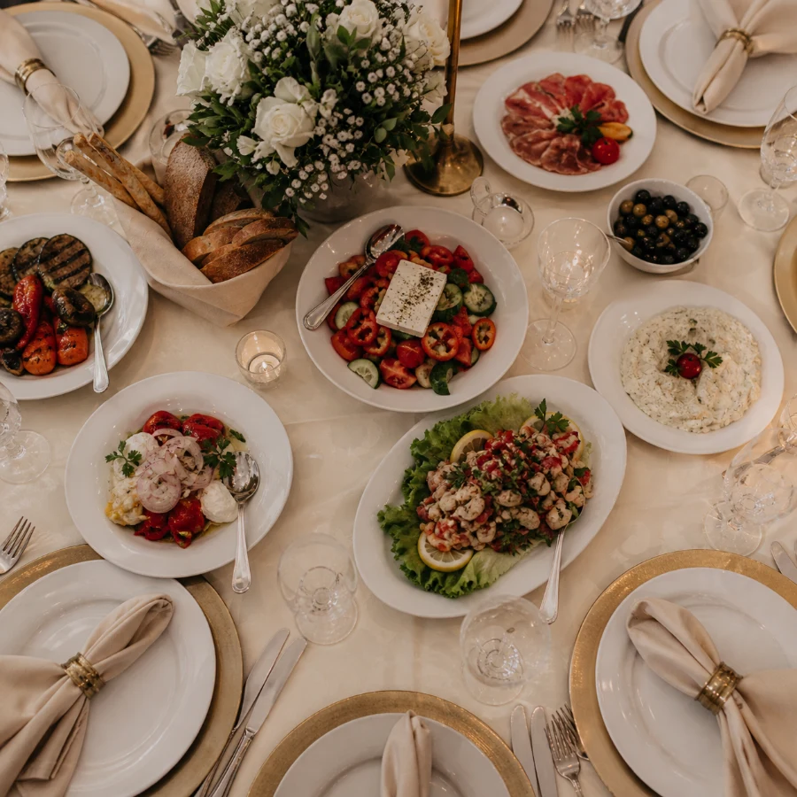 Formal banquet table with shared dishes and place settings